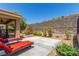 Relaxing backyard featuring lounge chairs and a serene desert view at 2398 Jada Dr, Henderson, NV 89044