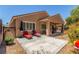 Charming backyard with patio, lounge chairs, and well-maintained landscaping at 2398 Jada Dr, Henderson, NV 89044