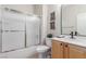 Bathroom featuring white fixtures, tiled floors and a sliding glass shower door at 2398 Jada Dr, Henderson, NV 89044