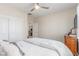 Bedroom with white walls, wood floors, double closets and ceiling fan at 2398 Jada Dr, Henderson, NV 89044