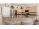 Well-equipped kitchen featuring granite countertops, stainless steel appliances, and a convenient breakfast bar at 2398 Jada Dr, Henderson, NV 89044