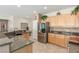 Well-equipped kitchen featuring granite countertops, stainless steel appliances, and a convenient breakfast bar at 2398 Jada Dr, Henderson, NV 89044