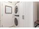 Convenient laundry room features a stacked washer and dryer and ample storage space at 2398 Jada Dr, Henderson, NV 89044