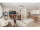 Bright living room features tile floors, recessed lighting, ceiling fan and comfortable seating arrangement at 2398 Jada Dr, Henderson, NV 89044