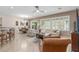 Open-concept living area with dining area, large windows, tile floors and comfortable seating arrangement at 2398 Jada Dr, Henderson, NV 89044