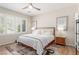 Serene main bedroom retreat with plantation shutters, wood floors, and stylish decor at 2398 Jada Dr, Henderson, NV 89044