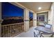 Outdoor balcony featuring dark metal railings, complemented by neutral-colored columns and providing scenic views at 2571 Red Springs Dr, Las Vegas, NV 89135
