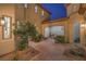 Beautiful courtyard with pavers, a mature tree, and an inviting archway at 2571 Red Springs Dr, Las Vegas, NV 89135