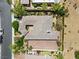 Aerial view of a luxury home with a tile roof, private courtyard, and meticulously landscaped grounds at 3048 Red Arrow Dr, Las Vegas, NV 89135