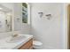 Neat bathroom with white tile, a modern sink, and neutral walls at 3048 Red Arrow Dr, Las Vegas, NV 89135