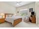 Comfortable bedroom featuring a ceiling fan, carpet, and warm neutral paint at 3048 Red Arrow Dr, Las Vegas, NV 89135