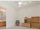 Bedroom showcasing a ceiling fan, built-in bookshelves, cabinets, and an open doorway to the bathroom at 3048 Red Arrow Dr, Las Vegas, NV 89135