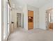 Bright bedroom with built-in cabinet, access to the balcony, and a doorway to the bathroom at 3048 Red Arrow Dr, Las Vegas, NV 89135