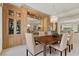 Elegant dining room featuring a wooden table, chandelier, and custom built-in cabinetry at 3048 Red Arrow Dr, Las Vegas, NV 89135