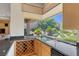 Kitchen featuring a counter with bar stools and view to greenery with granite countertops at 3048 Red Arrow Dr, Las Vegas, NV 89135