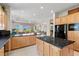 Open kitchen featuring modern appliances, granite countertops, and a spacious layout, ideal for culinary enthusiasts and gatherings at 3048 Red Arrow Dr, Las Vegas, NV 89135
