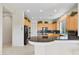 Modern kitchen featuring a breakfast bar, granite countertops, and modern appliances, perfect for cooking and casual dining at 3048 Red Arrow Dr, Las Vegas, NV 89135