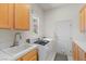 Functional laundry room area with sink, washer, and dryer at 3048 Red Arrow Dr, Las Vegas, NV 89135