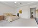 Large primary bedroom featuring a tray ceiling, neutral colors, and carpeted flooring, creating a serene retreat at 3048 Red Arrow Dr, Las Vegas, NV 89135