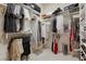 A spacious walk-in closet with ample shelving, hanging rods, and organized storage solutions at 3048 Red Arrow Dr, Las Vegas, NV 89135