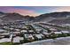 Aerial view of a residential community nestled in the mountains at 333 Mandarin Hill Ln, Henderson, NV 89012
