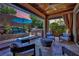 Backyard covered patio area with built in bbq and lush landscaped yard at 333 Mandarin Hill Ln, Henderson, NV 89012
