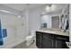 Modern bathroom with a glass-enclosed shower and a vanity with sleek, dark cabinetry at 333 Mandarin Hill Ln, Henderson, NV 89012
