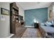 Well-lit bedroom with custom wall design, wood look floors, and modern furniture at 333 Mandarin Hill Ln, Henderson, NV 89012