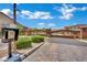 Gated community entrance with brick pillars, secure access, and well-maintained landscaping at 333 Mandarin Hill Ln, Henderson, NV 89012