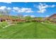 Expansive green space in a community park featuring walking paths and mature trees at 333 Mandarin Hill Ln, Henderson, NV 89012