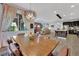 The dining area boasts natural light, a stylish light fixture, and an open floor plan that seamlessly connects to the kitchen at 333 Mandarin Hill Ln, Henderson, NV 89012