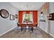 Inviting dining room with a rustic wood table and bright window, creating a warm and welcoming atmosphere at 333 Mandarin Hill Ln, Henderson, NV 89012