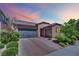 Charming single story home featuring a two-car garage and desert landscaping at 333 Mandarin Hill Ln, Henderson, NV 89012