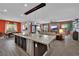 Open-concept kitchen with a large island flows into the living and dining areas at 333 Mandarin Hill Ln, Henderson, NV 89012