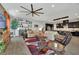 Spacious living room boasts an open floor plan, fireplace and generous seating, with easy access to the kitchen at 333 Mandarin Hill Ln, Henderson, NV 89012