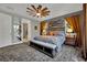 The main bedroom features a striking accent wall, complemented by a ceiling fan for optimal comfort at 333 Mandarin Hill Ln, Henderson, NV 89012