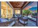 Relaxing covered patio features comfortable seating with a view of the private backyard at 333 Mandarin Hill Ln, Henderson, NV 89012
