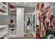 Bright walk-in closet features organized storage with ample shelves, cabinets, and clothing racks at 333 Mandarin Hill Ln, Henderson, NV 89012