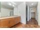 Bathroom featuring double sinks, a granite countertop, modern cabinetry, and tiled floors at 353 E Bonneville Ave # 711, Las Vegas, NV 89101