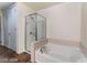Bathroom featuring a tiled tub/shower, tiled floors, and good lighting at 353 E Bonneville Ave # 711, Las Vegas, NV 89101