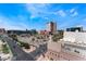 Panoramic city view features blue skies, palm trees and various buildings near a street intersection at 353 E Bonneville Ave # 711, Las Vegas, NV 89101