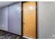 Apartment hallway entrance showing door, wall details, and carpeting at 353 E Bonneville Ave # 711, Las Vegas, NV 89101