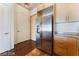 Kitchen featuring stainless steel appliances, wood cabinets, and hardwood floors at 353 E Bonneville Ave # 711, Las Vegas, NV 89101