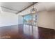 Bright living room featuring wood floors, modern lighting, and floor-to-ceiling windows with city views at 353 E Bonneville Ave # 711, Las Vegas, NV 89101