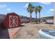 Backyard featuring shed, palm trees and some desert landscaping at 364 Dooley Dr, Henderson, NV 89015