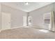 This bedroom offers neutral carpeting and paint, and abundant natural light at 364 Dooley Dr, Henderson, NV 89015