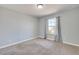 Bedroom featuring neutral paint, carpeting, and baseboards, with a window for natural light at 364 Dooley Dr, Henderson, NV 89015