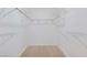 Walk-in closet with custom shelving and laminate flooring at 364 Dooley Dr, Henderson, NV 89015
