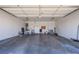 Spacious garage with concrete floor, ample storage, and work space at 364 Dooley Dr, Henderson, NV 89015