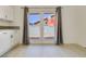Kitchen with doors leading to the backyard with a white wall and granite countertops at 364 Dooley Dr, Henderson, NV 89015